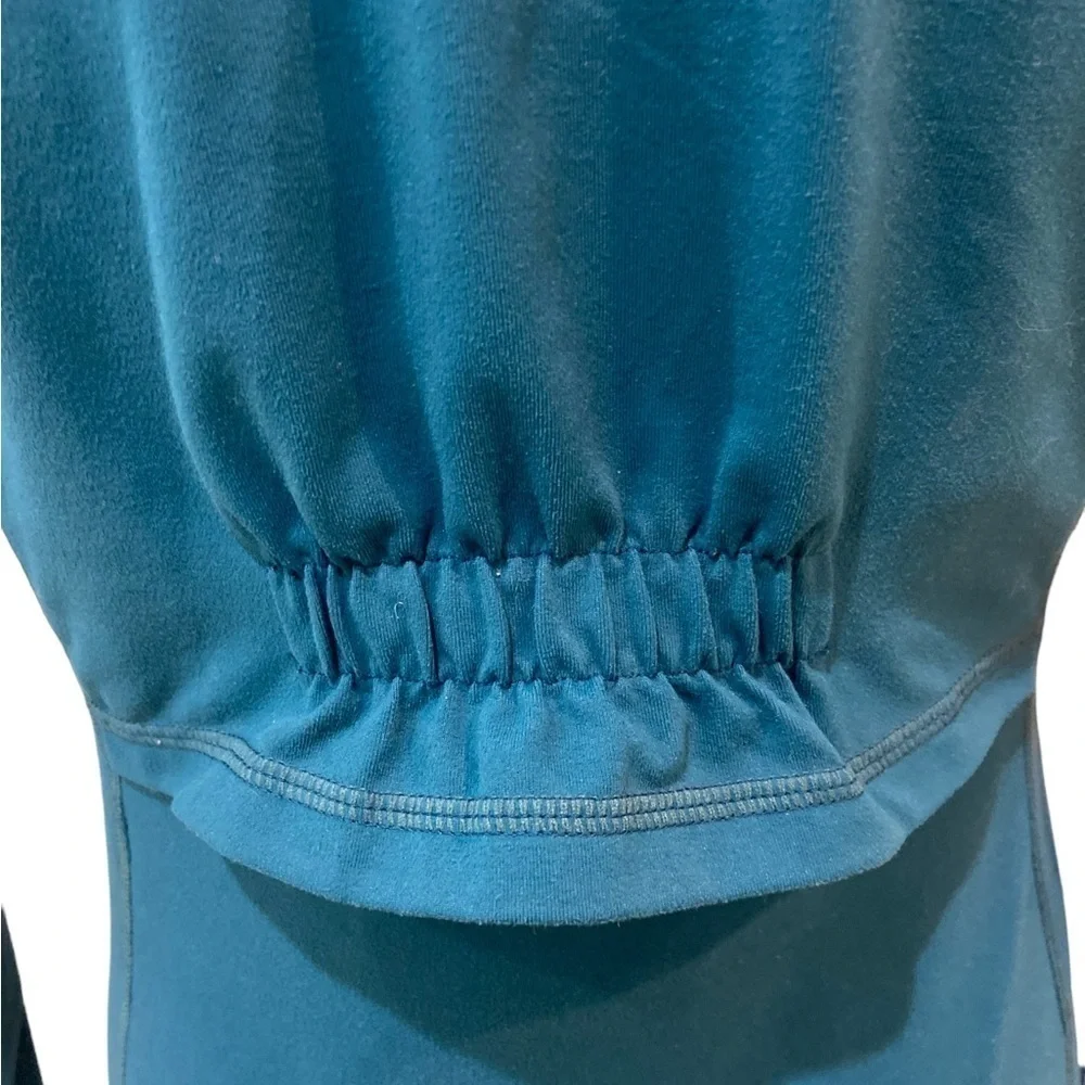 Zella zip up teal ruched athletic jacket with zip up pockets & ruffle back small